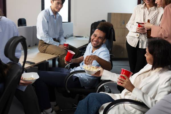 Diverse group of young people socializing at a gathering - Group and Centre-Based Activities